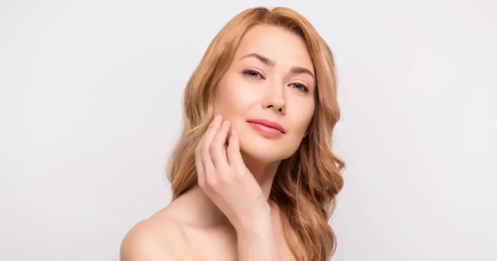Woman showcasing glowing skin from Glutathione treatments in McLean, VA